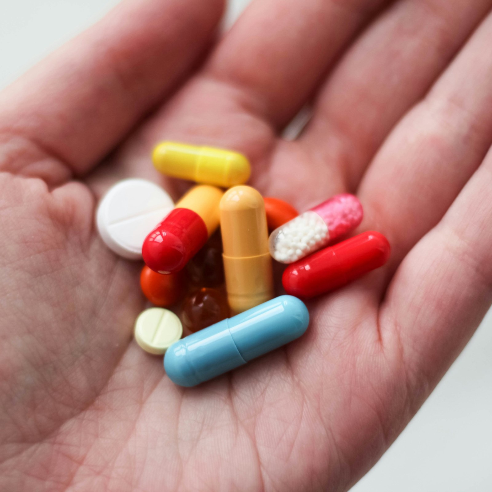 a medication pill in a person's hand