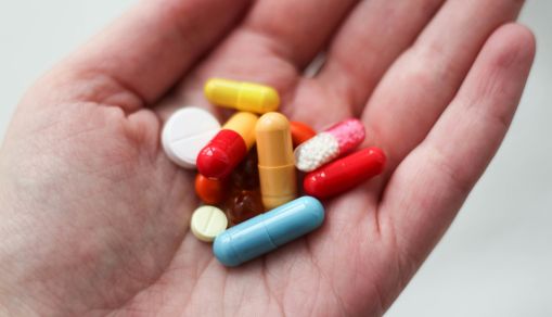 a medication pill in a person's hand