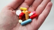a medication pill in a person's hand
