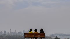Smoke haze from bushfires in New South Wales is seen over the CBD of Sydney from Dudley Page Reserve in Sydney