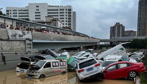 Cars trapped in floodwaters after heavy rains hit the city of Zhengzhou