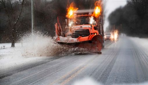 Snowplow clearing streets