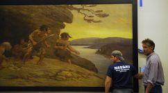 Mike Nigro (L) and Sam Seawright (R) help install Charles R