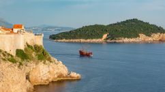A rocky cliff by the water