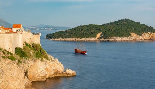 A rocky cliff by the water